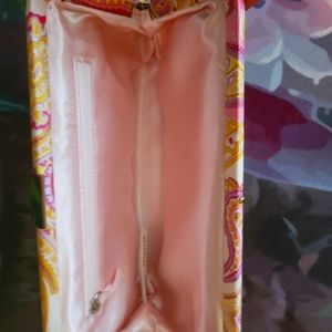 Pink and gold paisley clutch